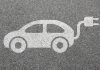 foto de carro elétrico desenhado no asfalto
